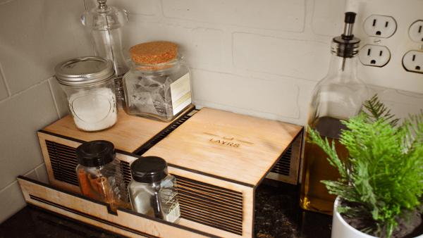 A top view of various ingredients sitting in a LAYRS shelf stand.