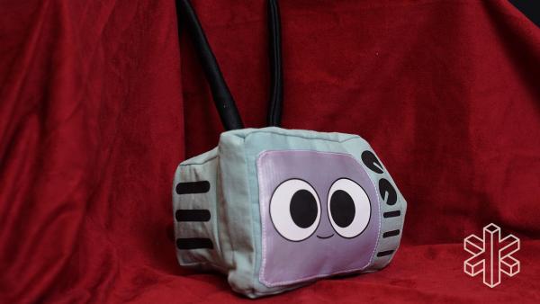 The cartoon TV sits on a red backdrop.