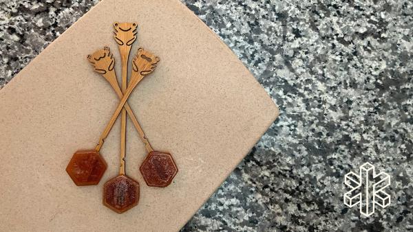 Three Lollihops lay on top of each other on a countertop.