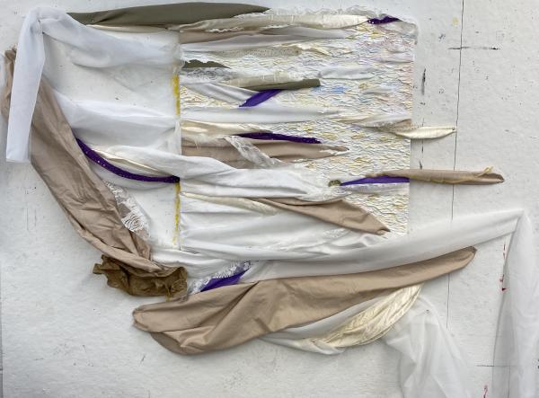 Fabric art piece by Madeline with purple, white, and beige fabric