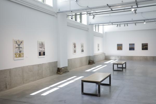 The walls of Urban Arts Space filled with paintings by Glenn Holland