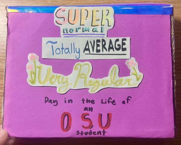 A handmade collage on purple cardstock featuring various cutout phrases in different colors and fonts. The text reads, from top to bottom: "SUPER normal," "Totally AVERAGE," "Very Regular," and "Day in the Life of an OSU student". The words "Very Regular" are decorated with small pink flowers on either side.