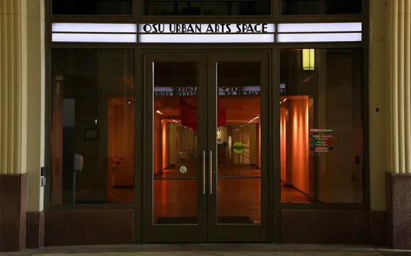 Closed glass double doors with "OSU Urban Arts Space" lit above the doors.