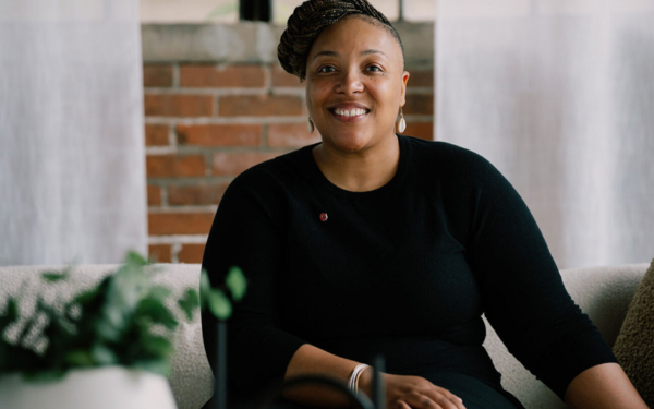 tyiesha smiling in a black top