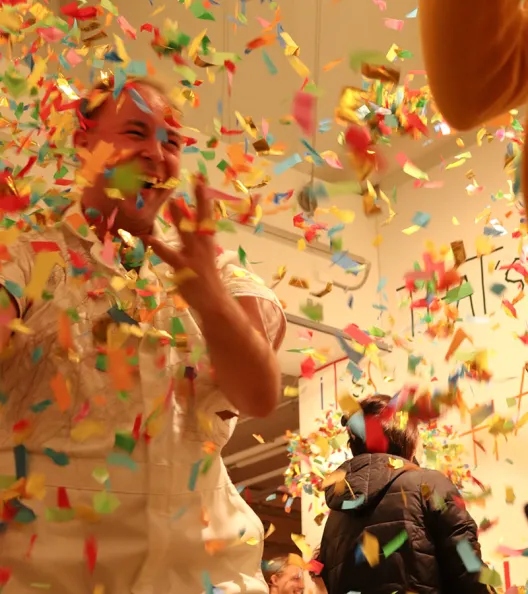 John excited as confetti is thrown around him