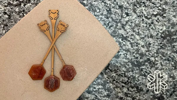 Three Lollihops lay on top of each other on a countertop.