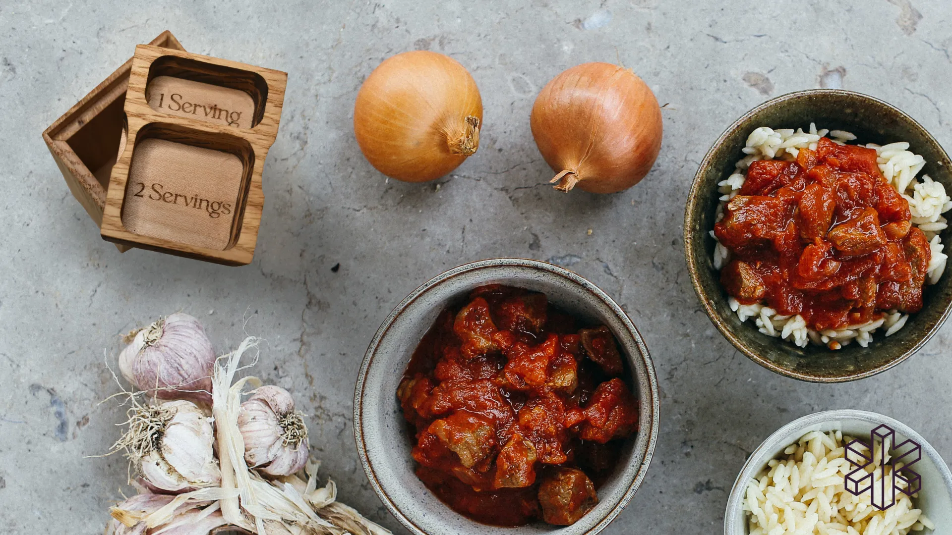 smaller wooden spice container beside onions and other foods