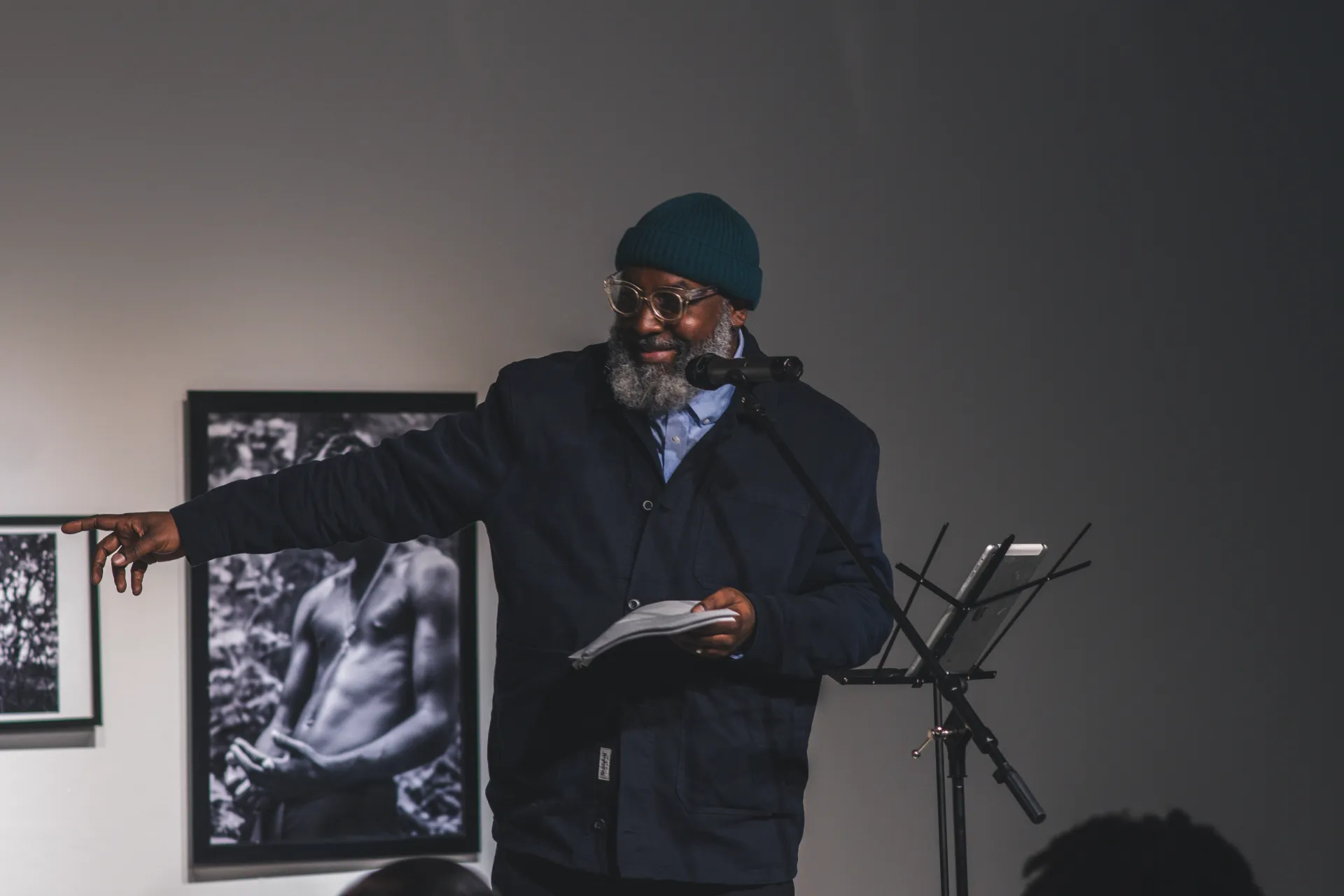 Roger in a hat performing poetry for the crowd