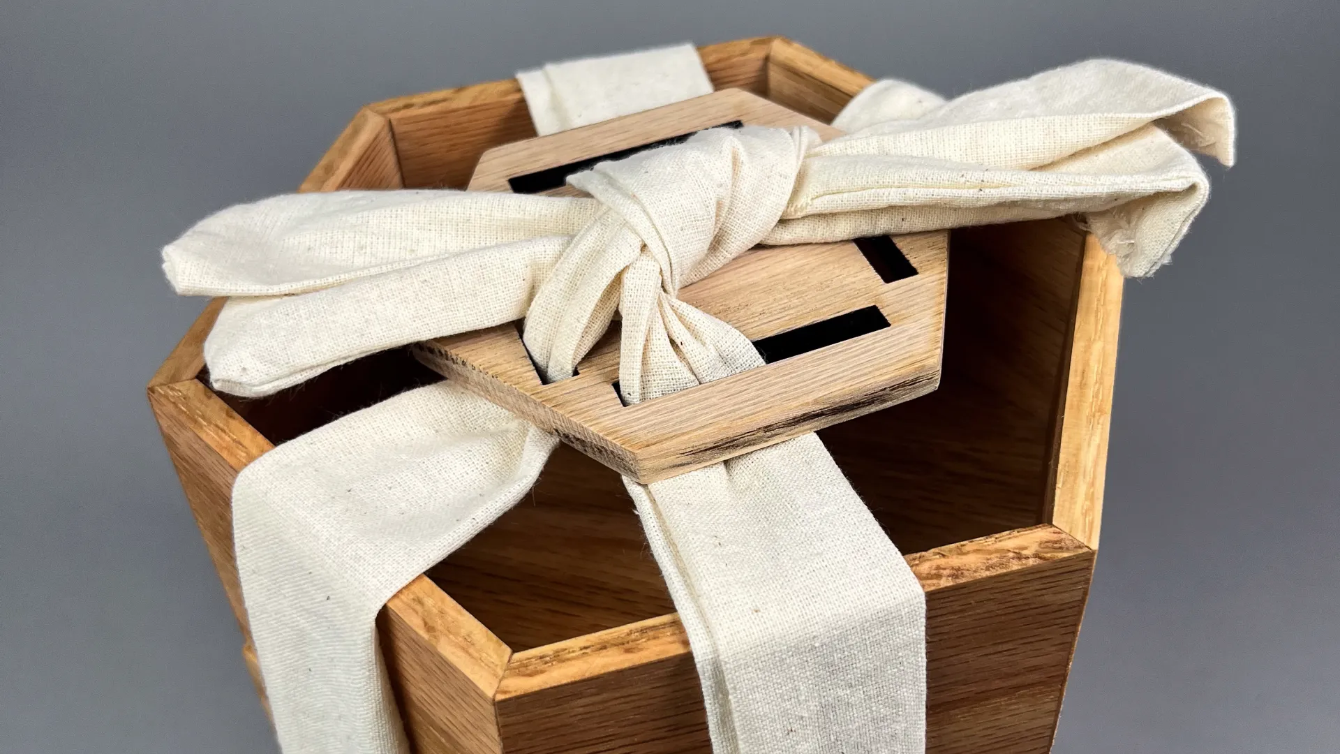wooden hexagonal box tied with a bow