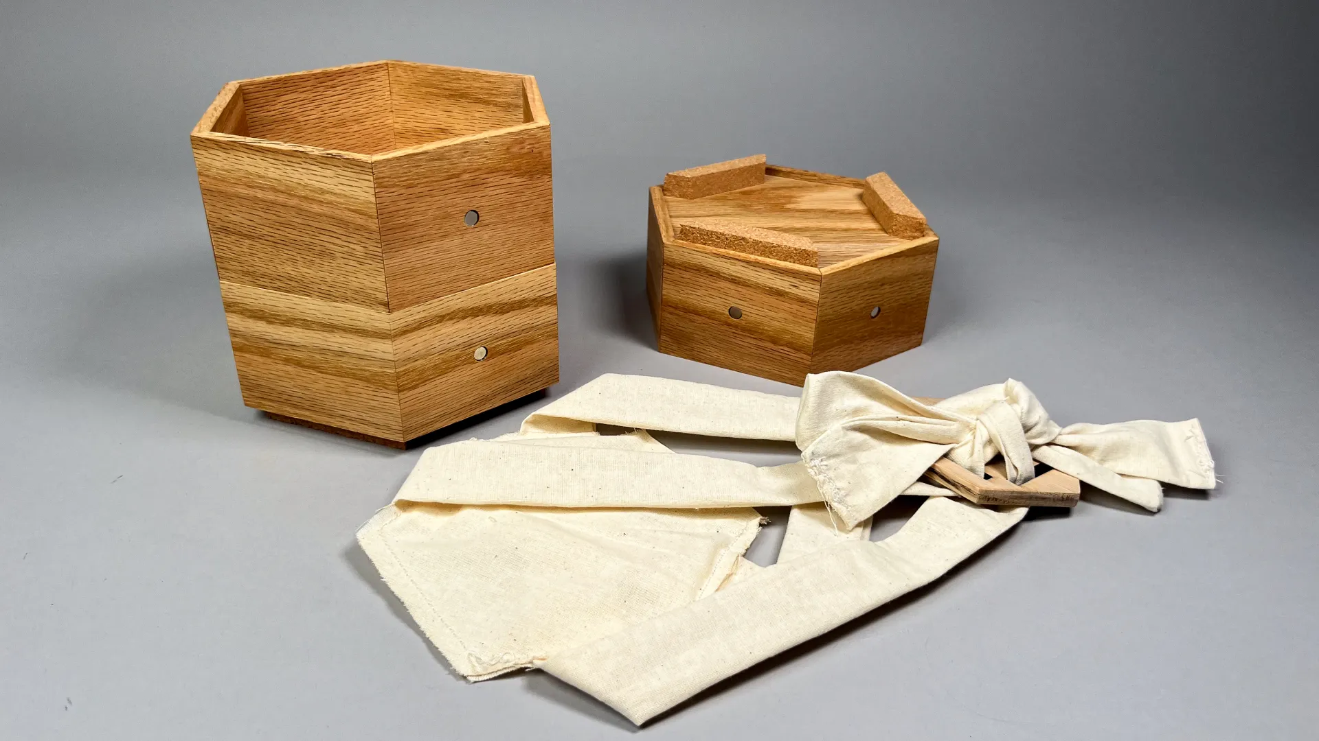 hexagonal wooden boxes next to white fabric
