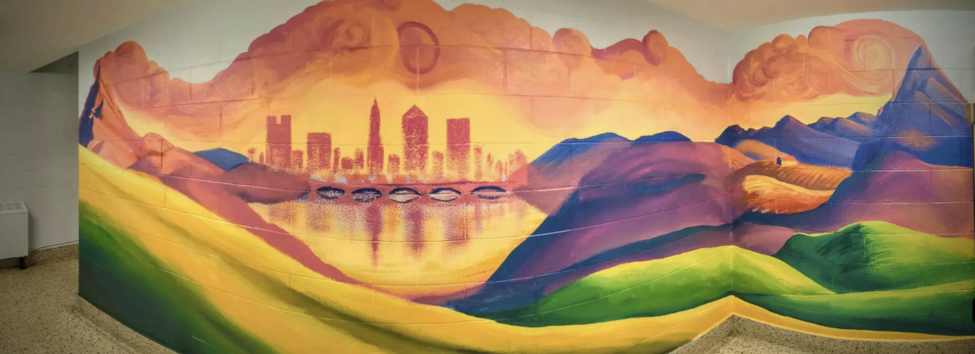 A mural of Columbus with warm colors in the back