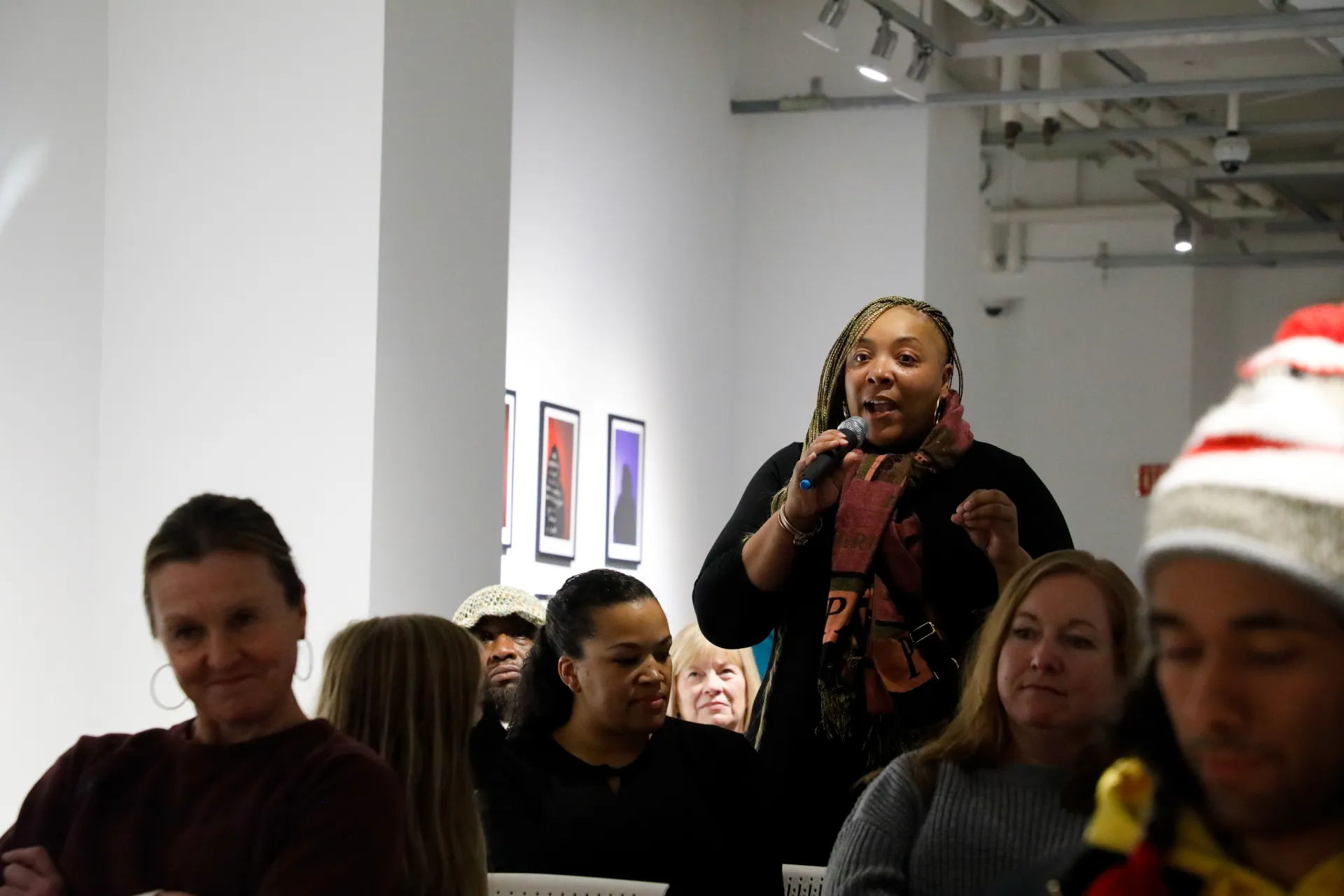 tyiesha asking a question at a poetry reading