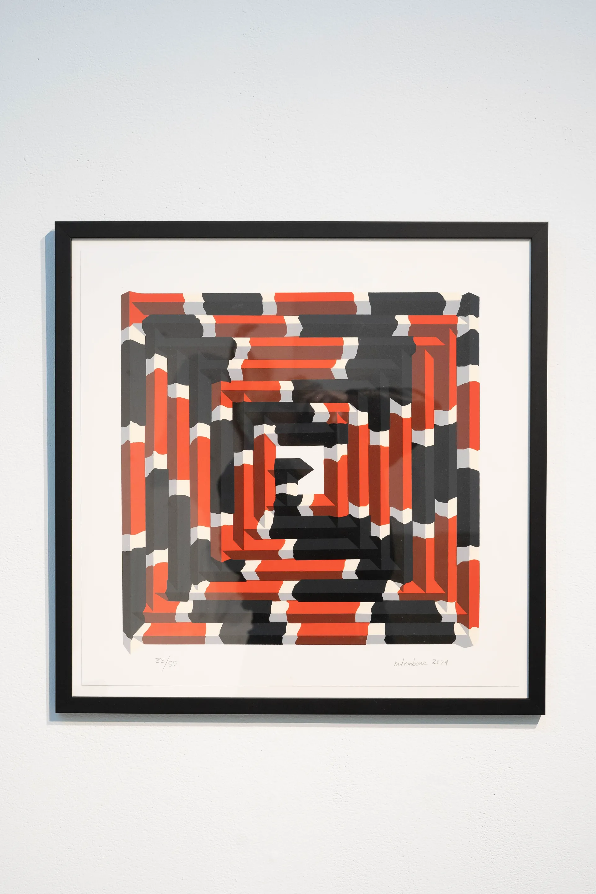 square pattern with snake-like coils in red, black, and white