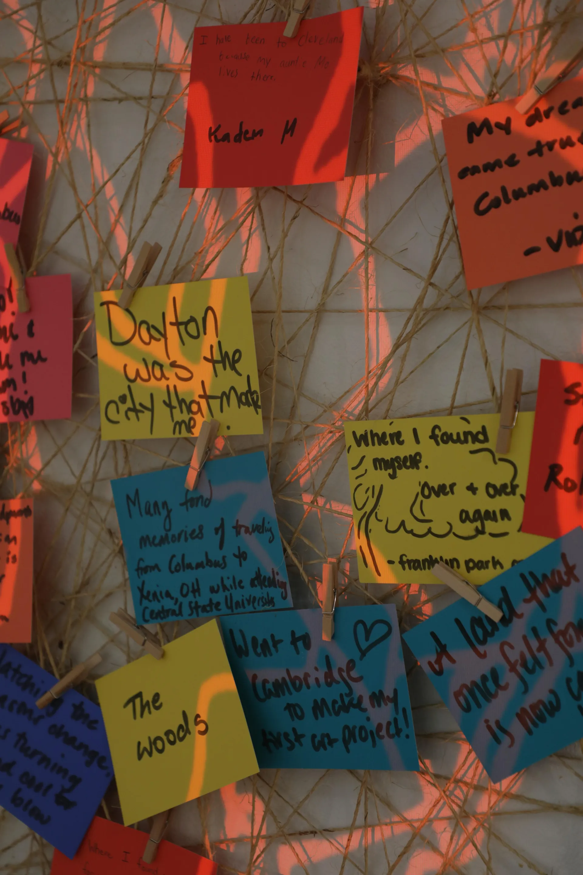 Guests have written notes about Ohio memories that have been attached to twine 