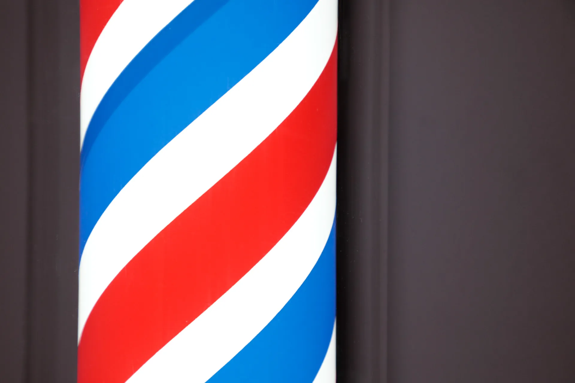 A barber's pole with blue, white, and red stripes 