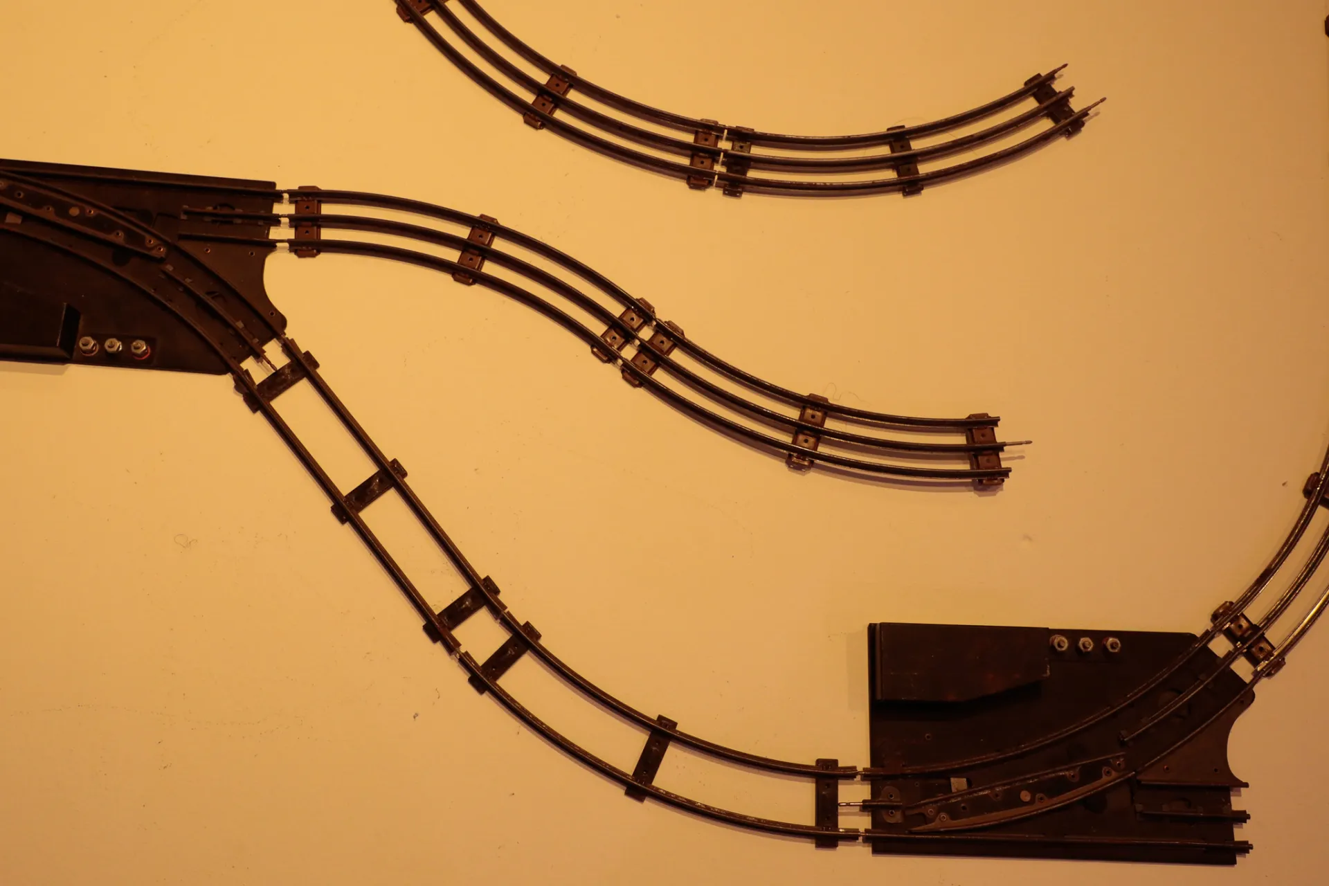 A series of railroad tracks are placed on a display block 