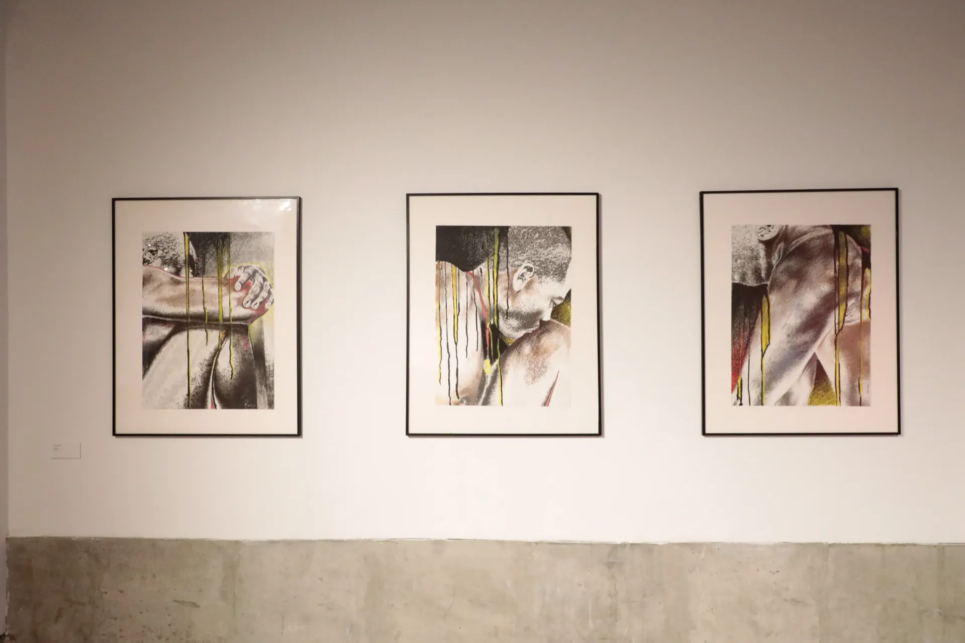Three framed mixed media pieces depicting a man 