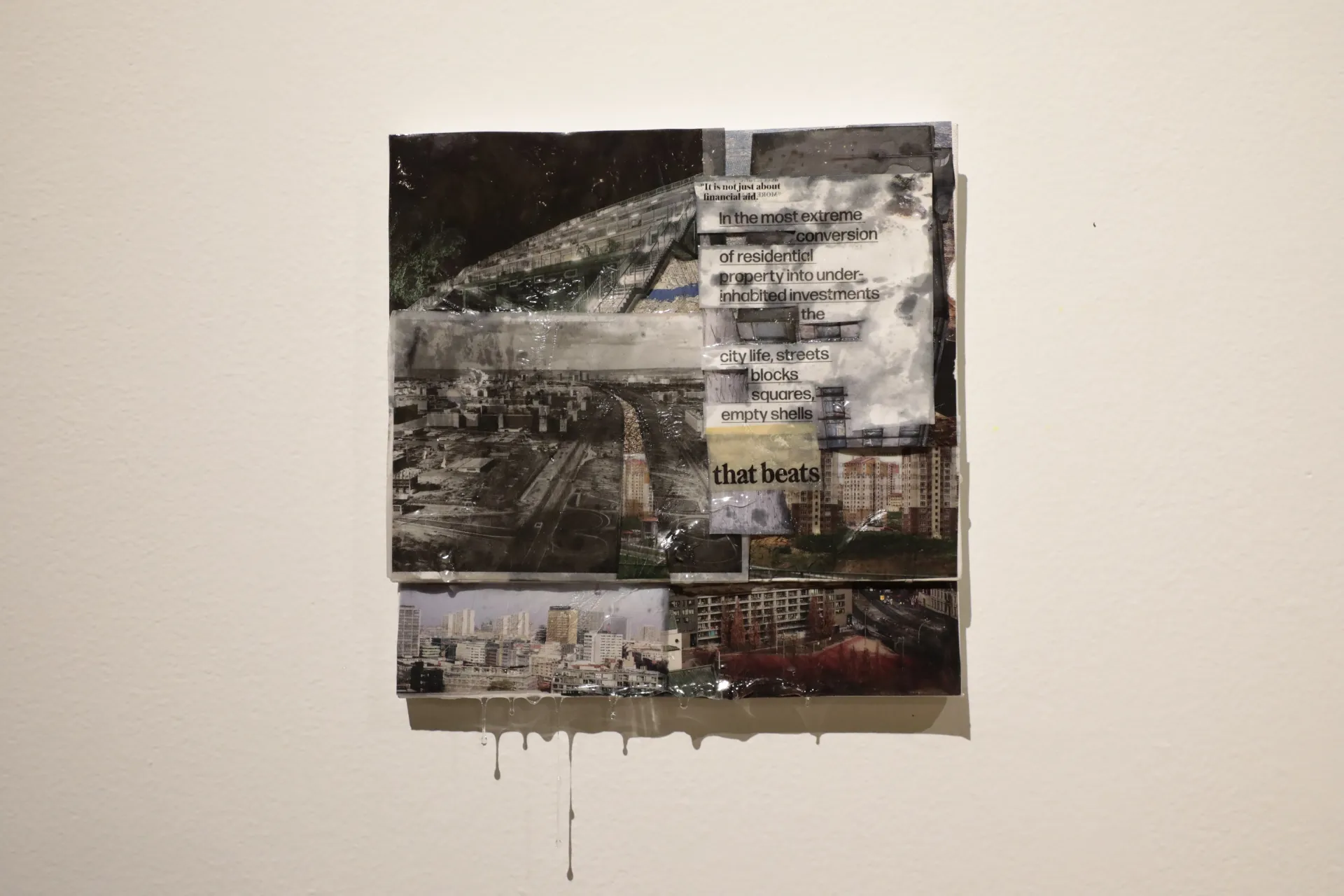 A square collage piece of city landscapes and text. 