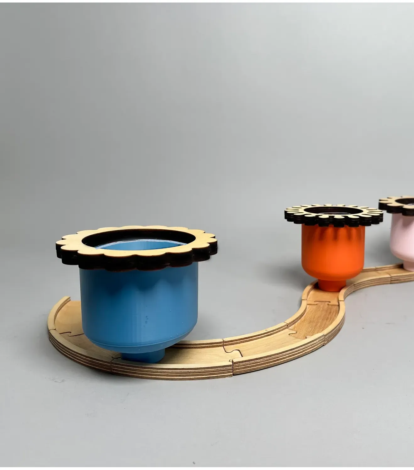 close up of blue snack cup on a wooden track