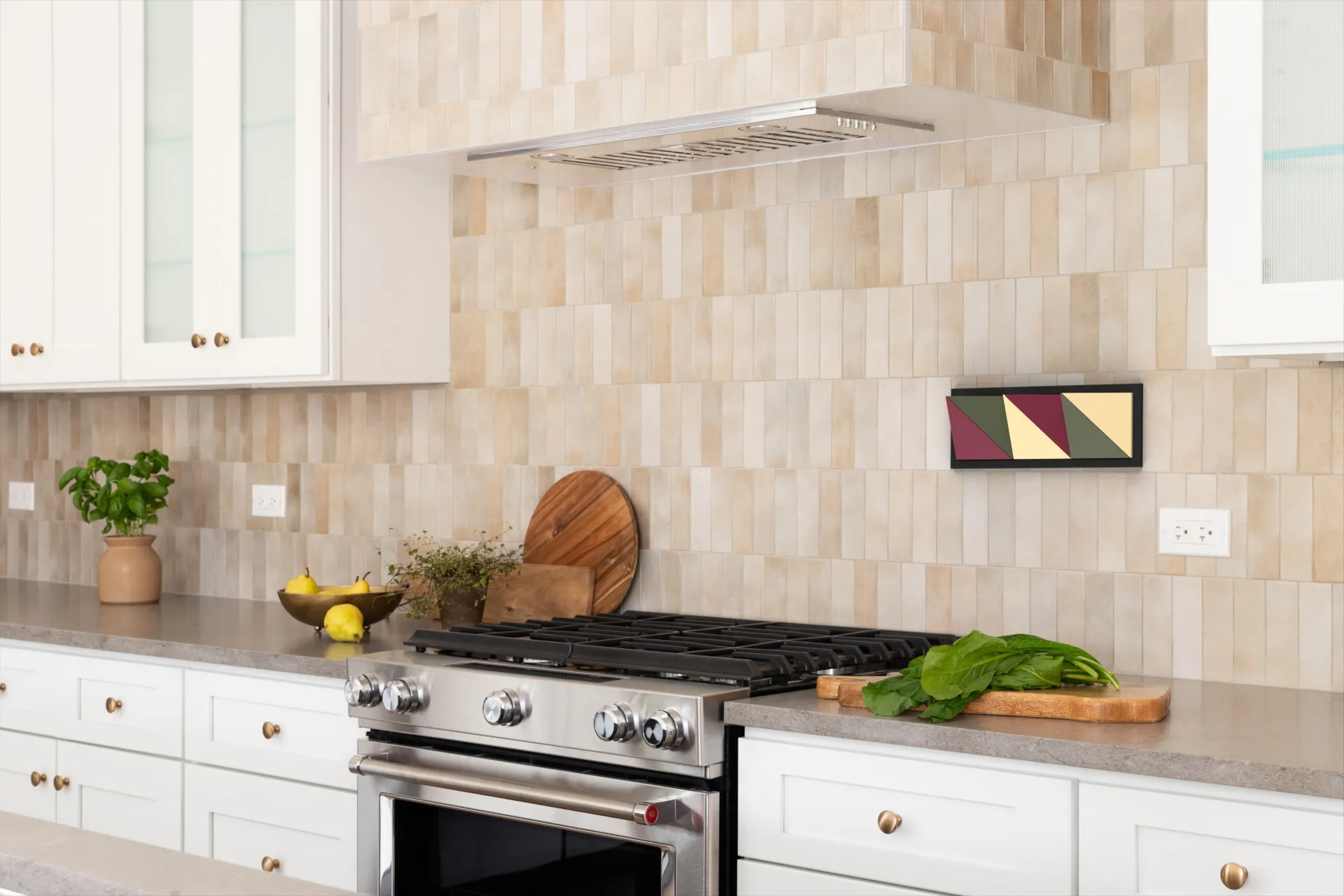 wall with clips on a magnet in a kitchen above a stove
