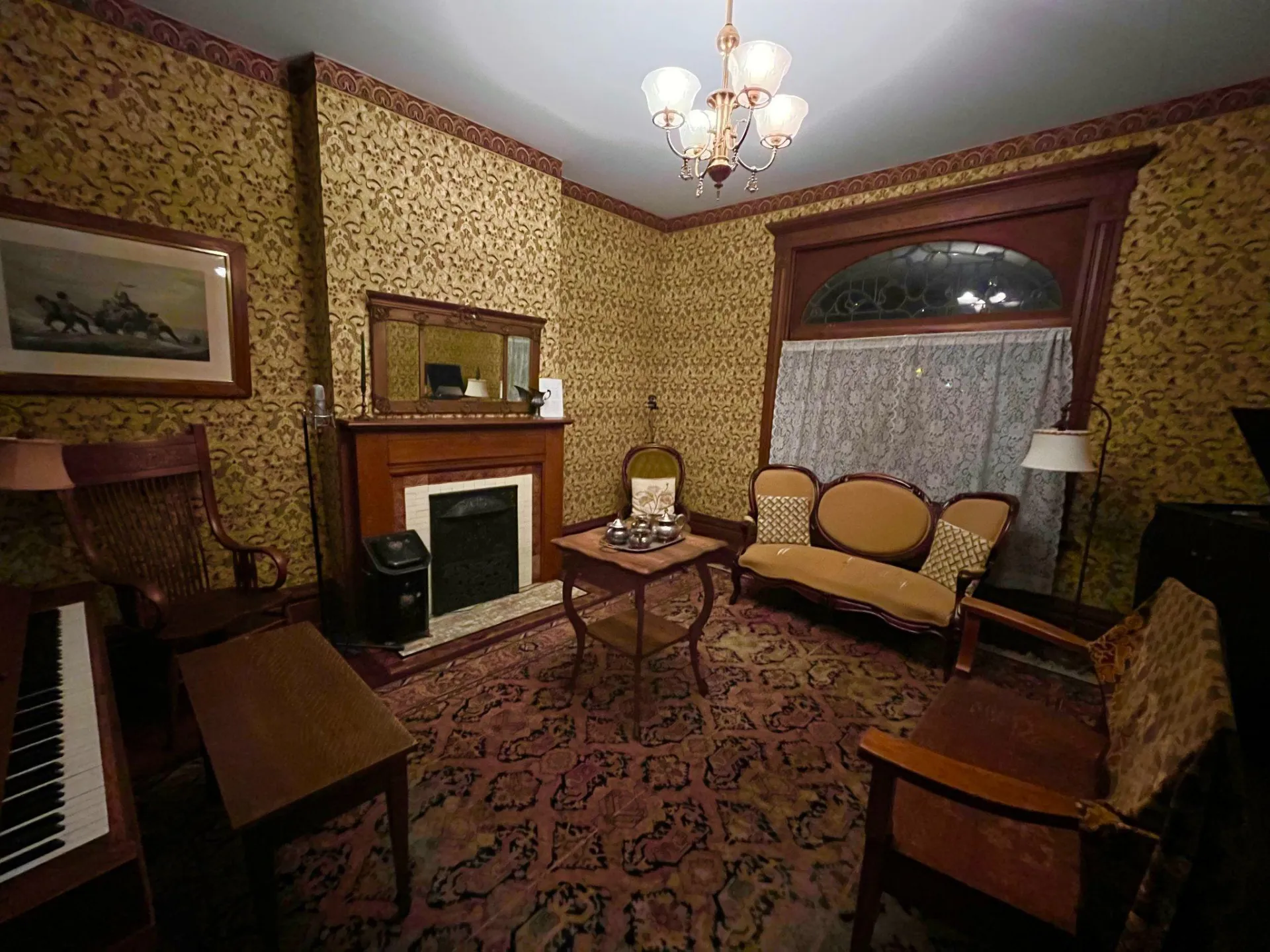 thurber house living room with chairs and a fireplace