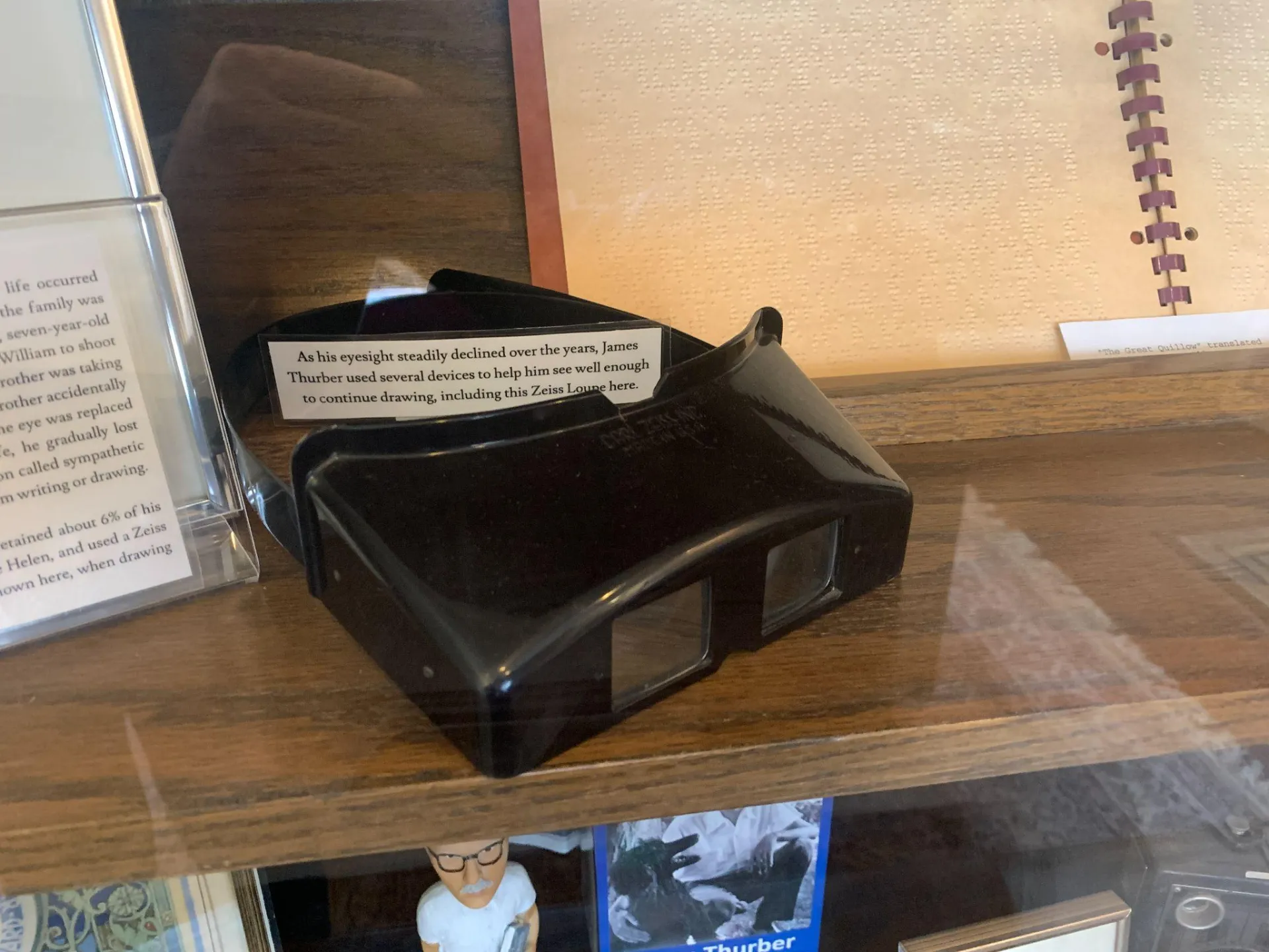 black binoculars on a shelf