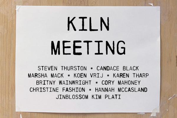 White paper with brown background with the words ‘Kiln Meeting’