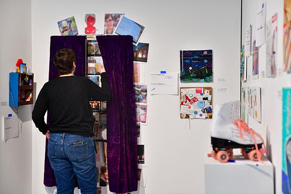 A viewer interacting with an installation in the exhibition titled Trace Layer Play 3.