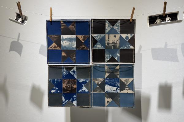 An art piece of an Ohio star quilt that features cyanotype images of family members and nature scenes.