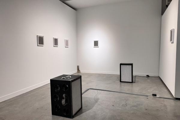 gallery space with air filters and photograms
