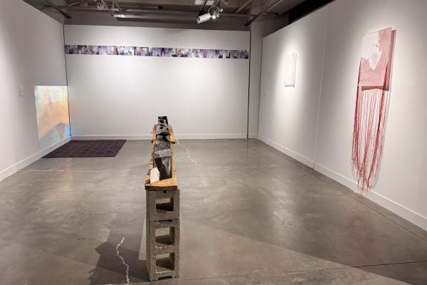 gallery space with yarn and abstract sculptures