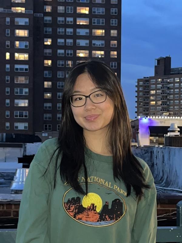 sophie wu in a national park sweatshirt in front of a building