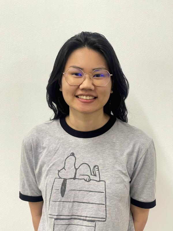 Katie wearing glasses and a Sloopy shirt