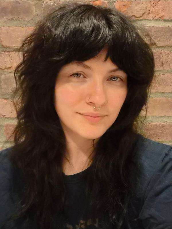 Kaeli with a closed mouth smile