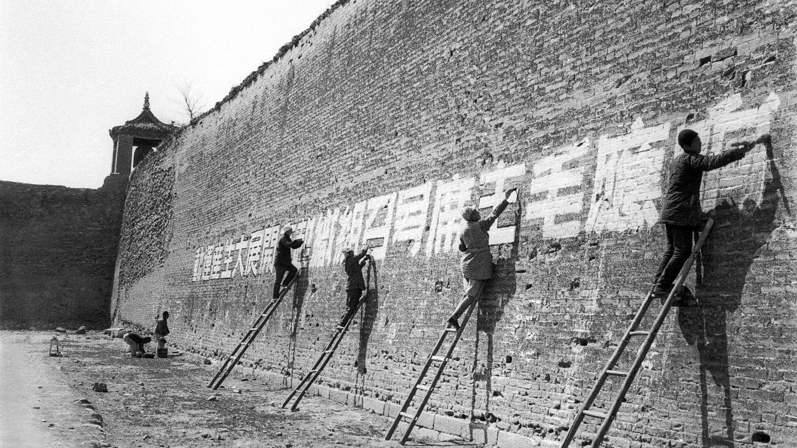 Workers Painting Political Slogans on the City Wall of Lingshou, Shanxi Province, 1945