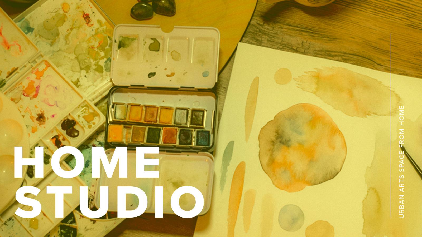 A set of watercolor palettes and a paper with watercolor drawings, covered by a yellow overlay and text that says "Home Studio"