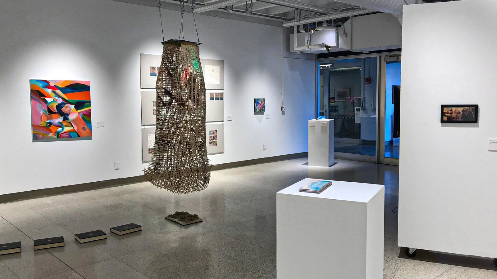 An exhibition at Hopkins Hall Gallery includes a hanging sculpture and and wall art.