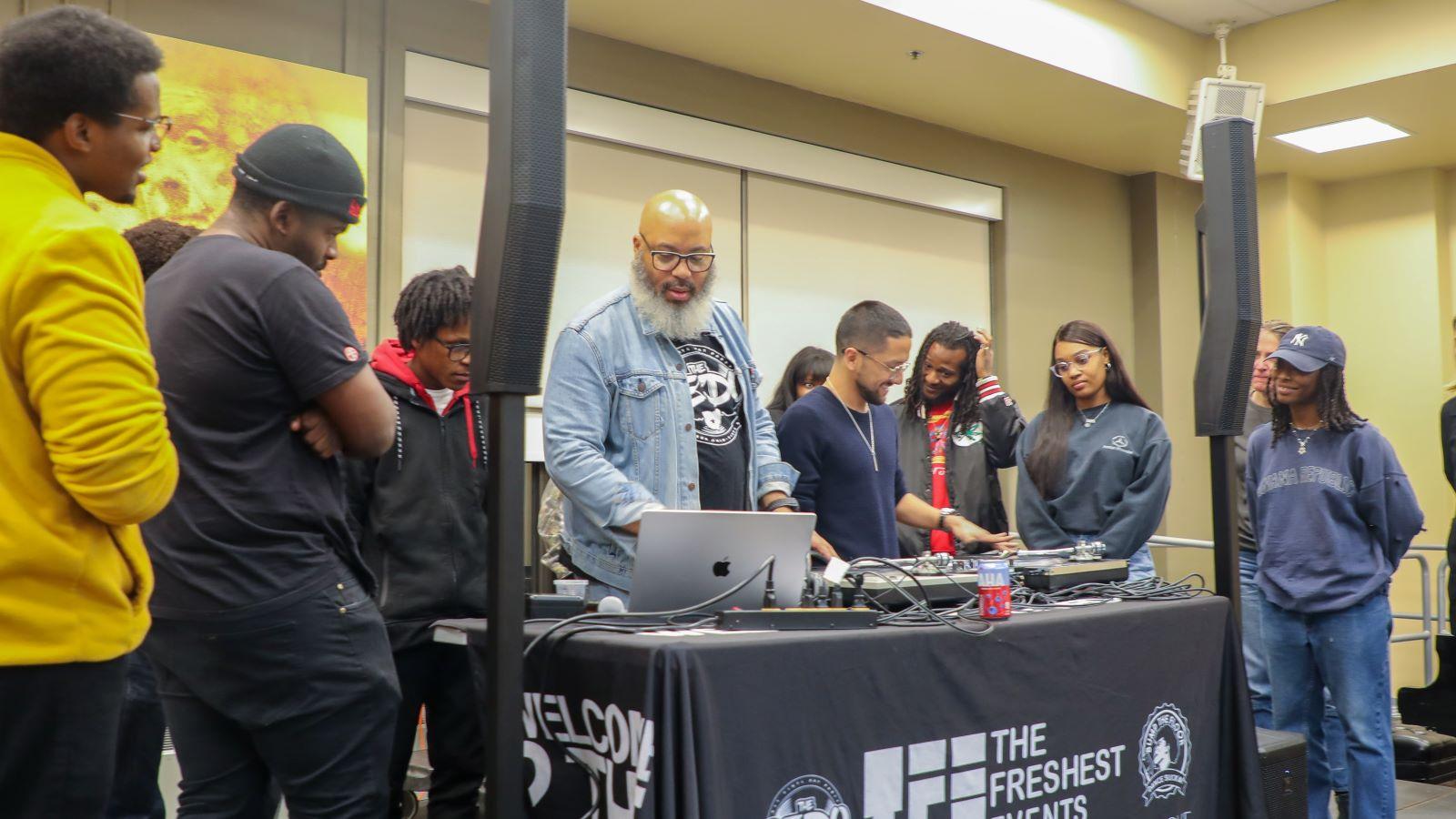 DJ O Sharp leading a music demonstration at the Roots & Rhythms event/
