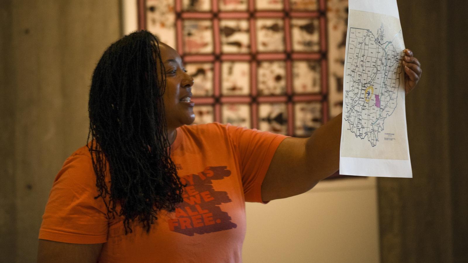 Tyiesha Radford Shorts holding up a map of Ohio