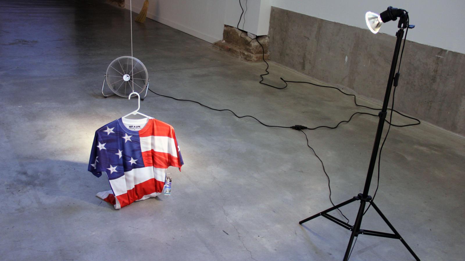 Image of Andres Felipe Castelblaco Olaya: "Free (or get a life)," video, monitor, t-shirt, fan, 2013-2014