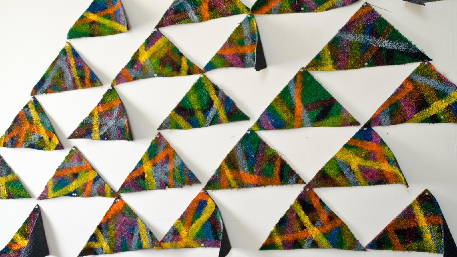 Luke Ahern: "Turf Triangles," enamel, livestock marker on shaped artificial turf, 2014 
